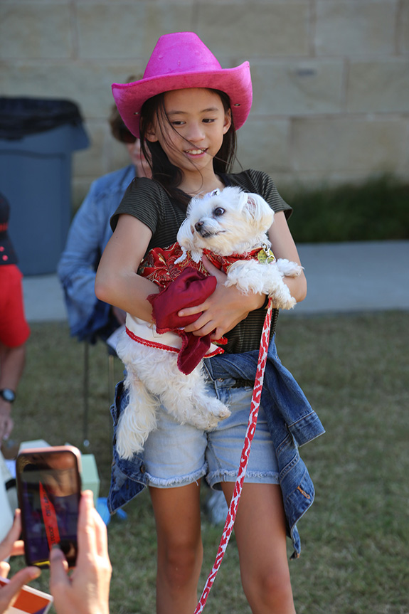 Cookies, hot dogs and chips and fun and games and a photo shoot were all part of Saturday's Parade of Pooches at the Moody Family YMCA