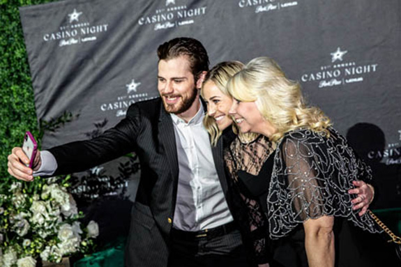 Dallas Stars player Tyler Seguin takes a selfie with fans
