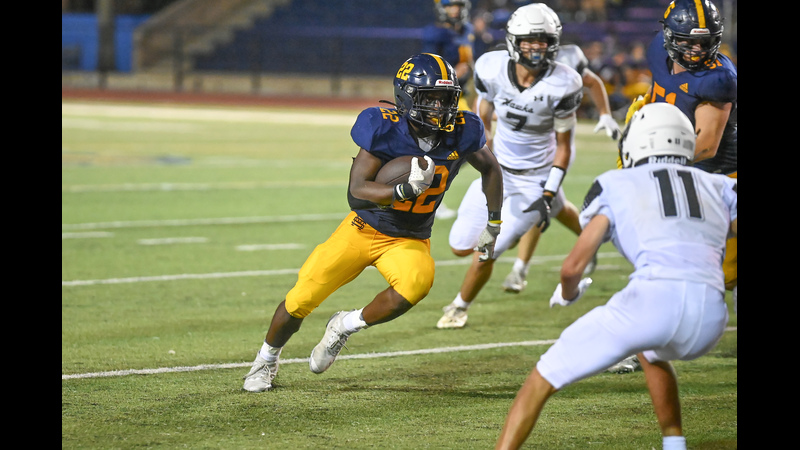 St. Mark's running back David Dickson turns upfield for yardage against Cistercian.